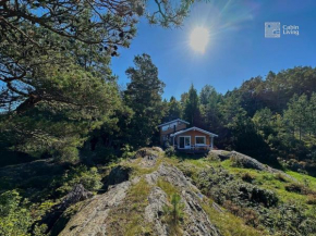 Seaside cabin with boat and beach in Kragerø